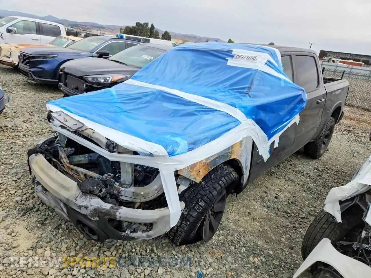 1 Photograph of a damaged car 1C6SRFLT4NN310175 RAM 1500 2022