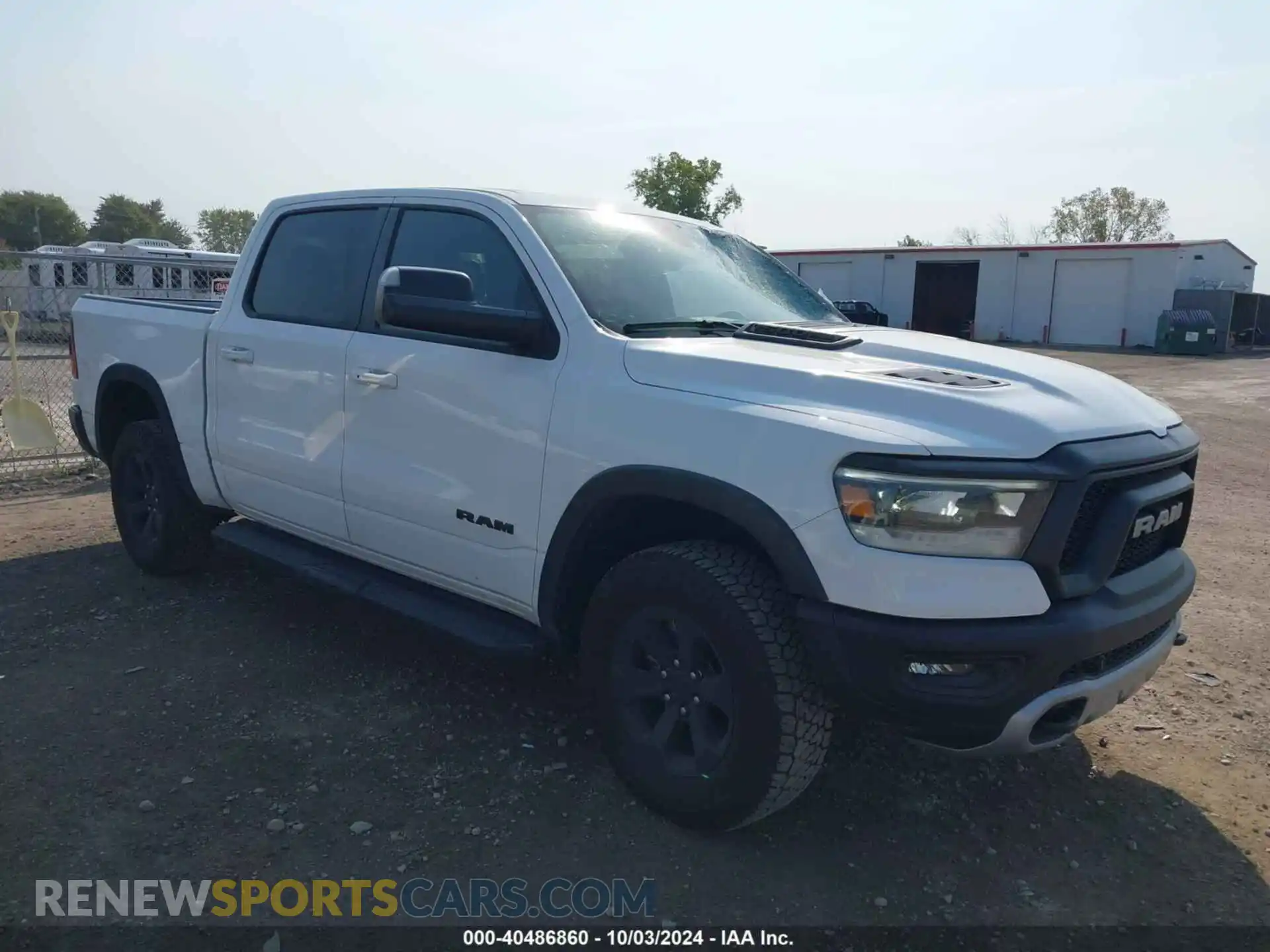 1 Photograph of a damaged car 1C6SRFLTXNN338532 RAM 1500 2022