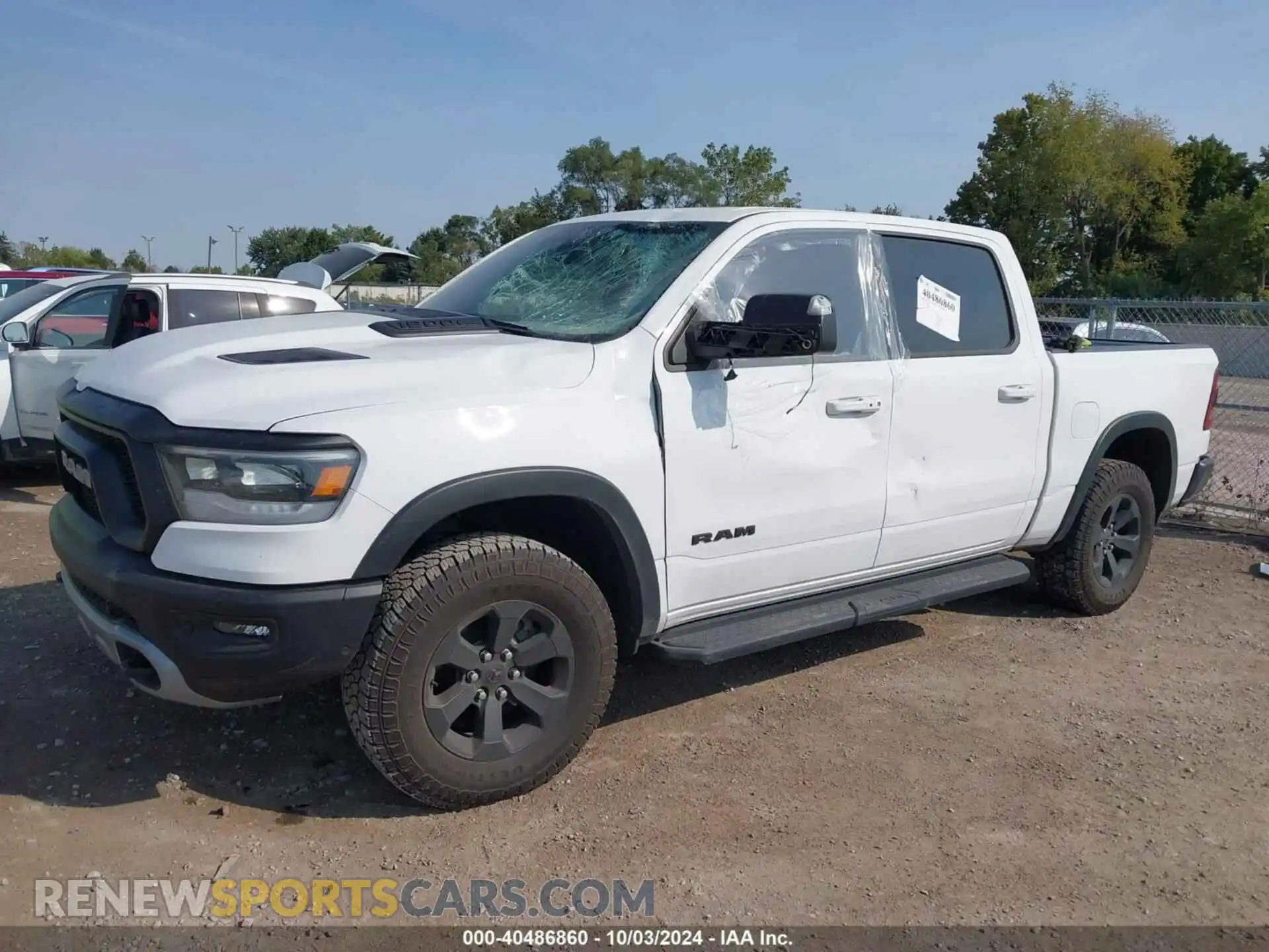 2 Photograph of a damaged car 1C6SRFLTXNN338532 RAM 1500 2022