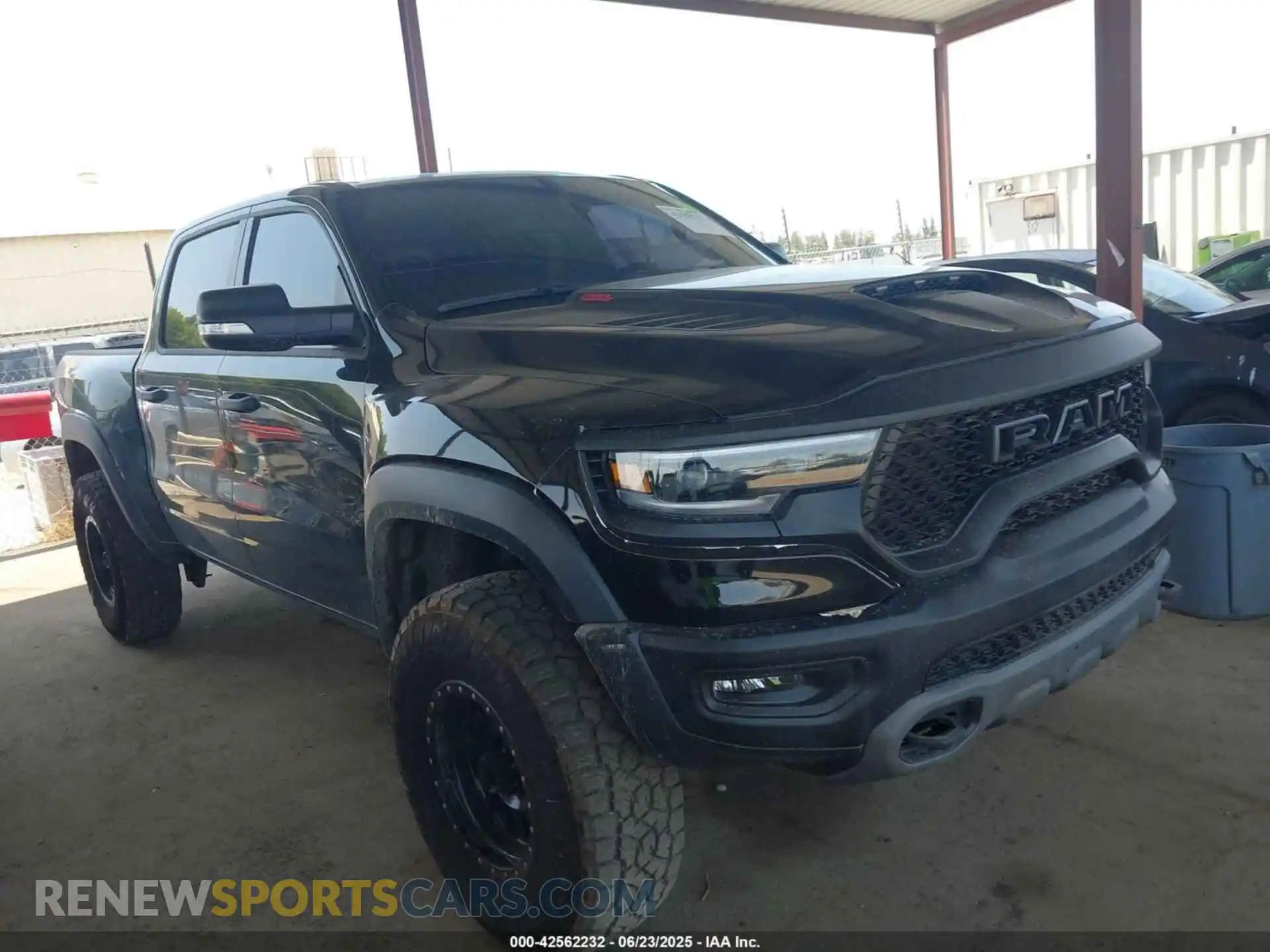 1 Photograph of a damaged car 1C6SRFU90NN369047 RAM 1500 2022