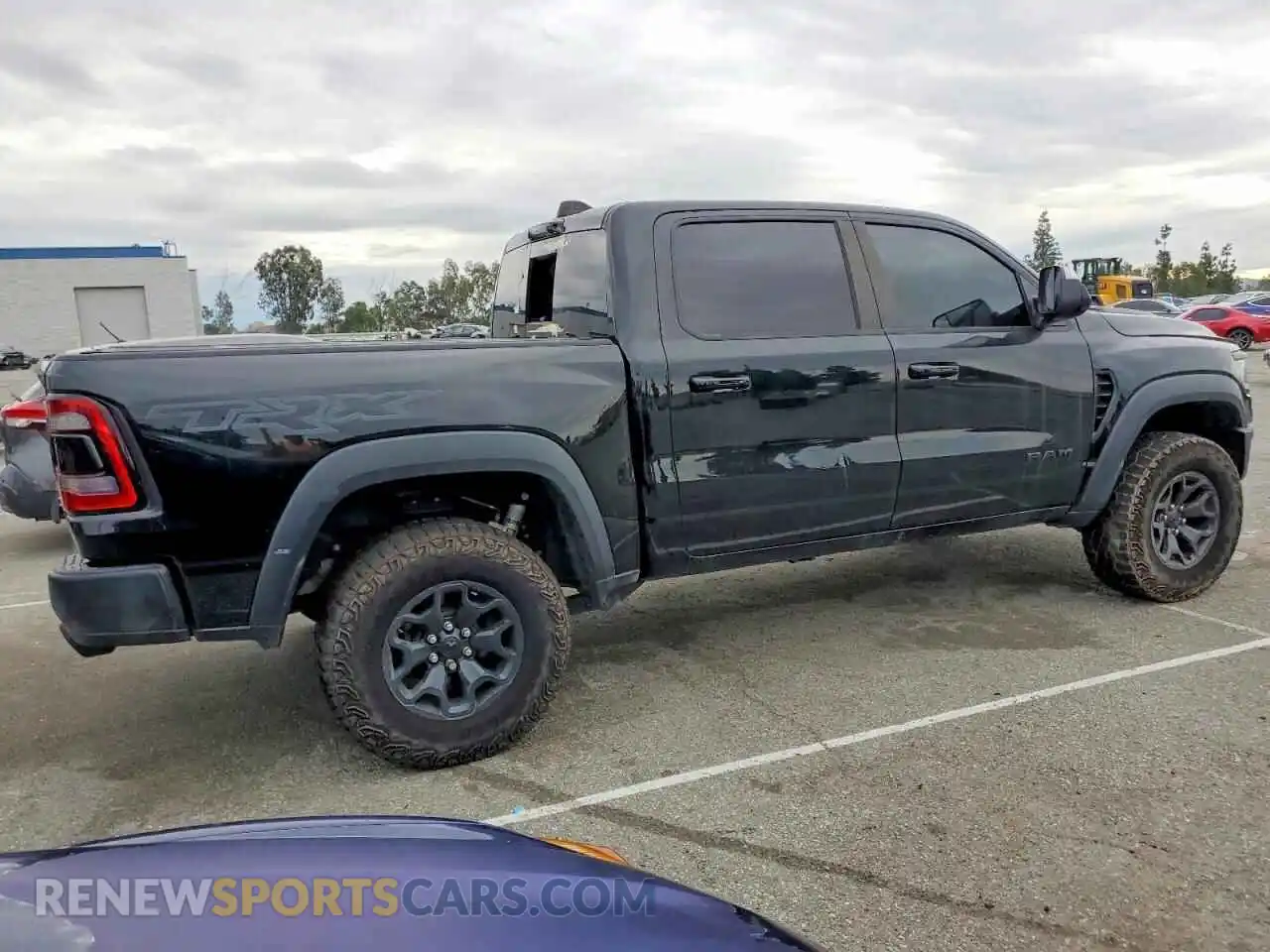 3 Photograph of a damaged car 1C6SRFU91NN424573 RAM 1500 2022