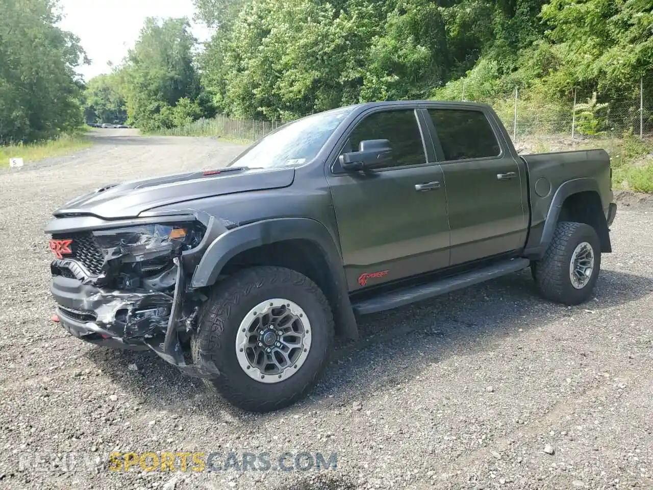 1 Photograph of a damaged car 1C6SRFU97NN168326 RAM 1500 2022