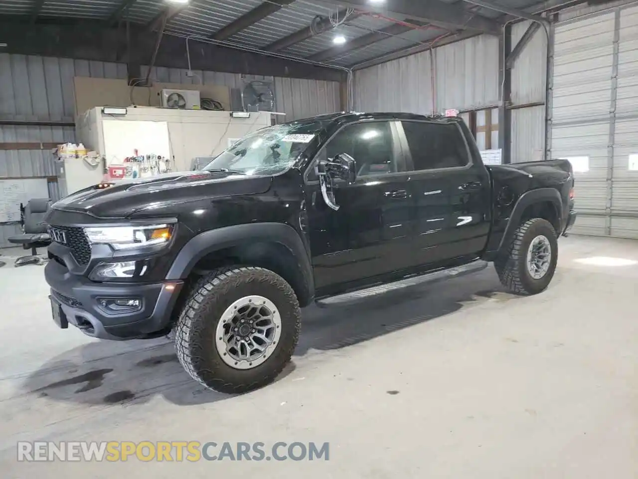 1 Photograph of a damaged car 1C6SRFU99NN320249 RAM 1500 2022