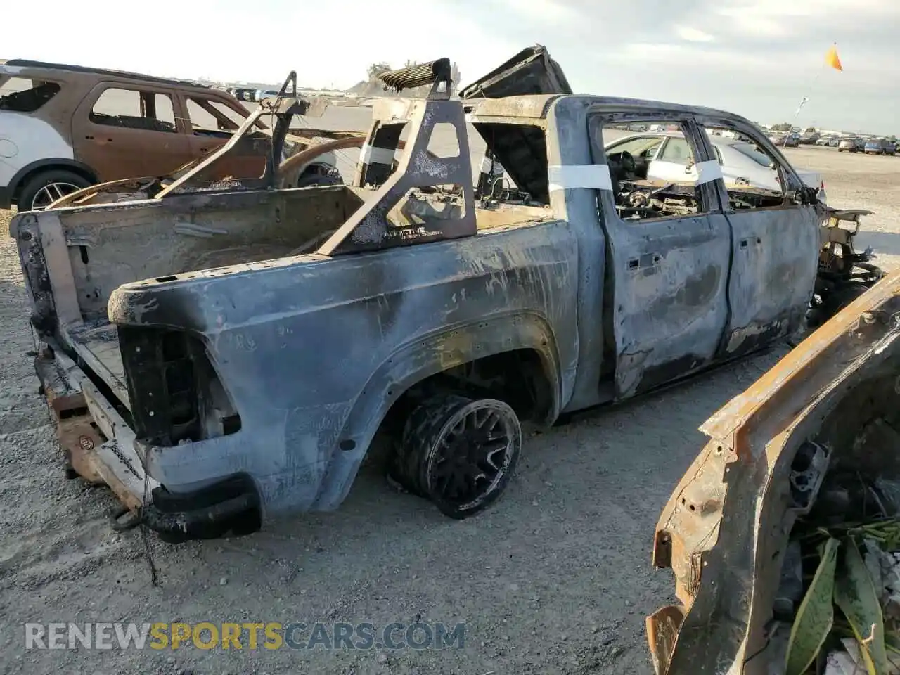 3 Photograph of a damaged car 1C6SRFU9XNN315867 RAM 1500 2022