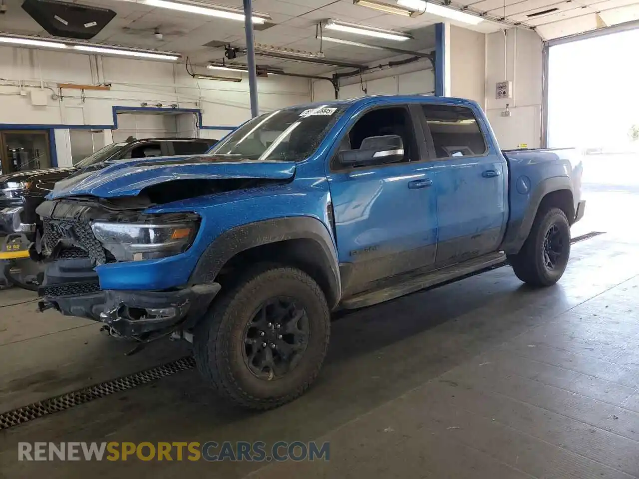 1 Photograph of a damaged car 1C6SRFU9XNN319062 RAM 1500 2022