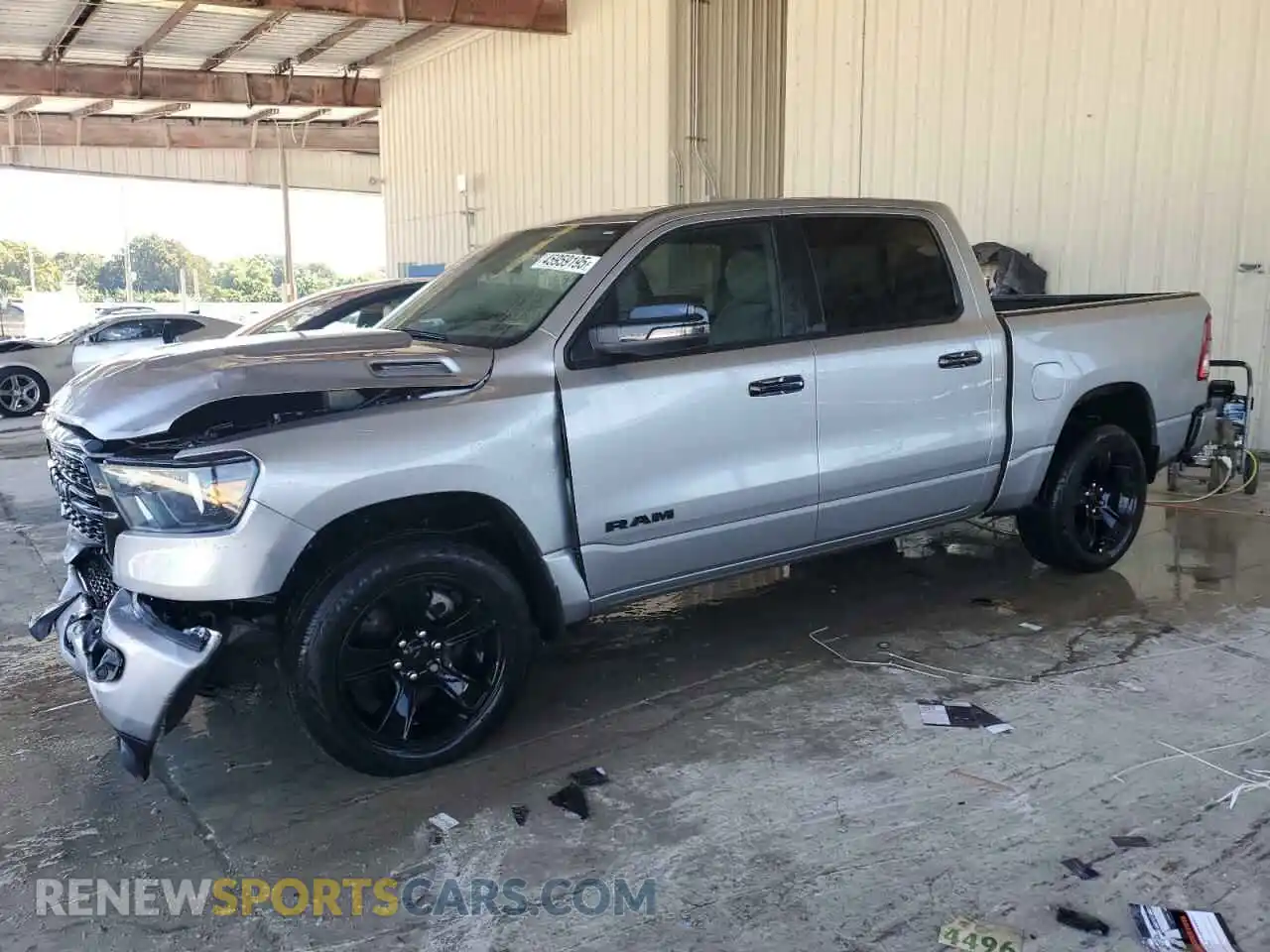 1 Photograph of a damaged car 1C6RREFG5PN654513 RAM 1500 2023