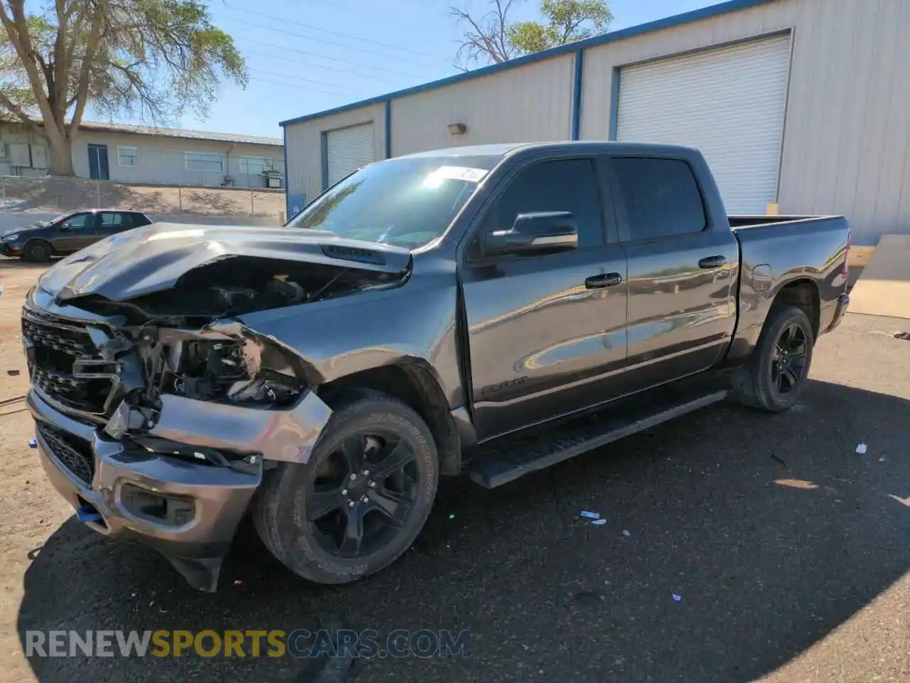 1 Photograph of a damaged car 1C6RREFT0PN694088 RAM 1500 2023