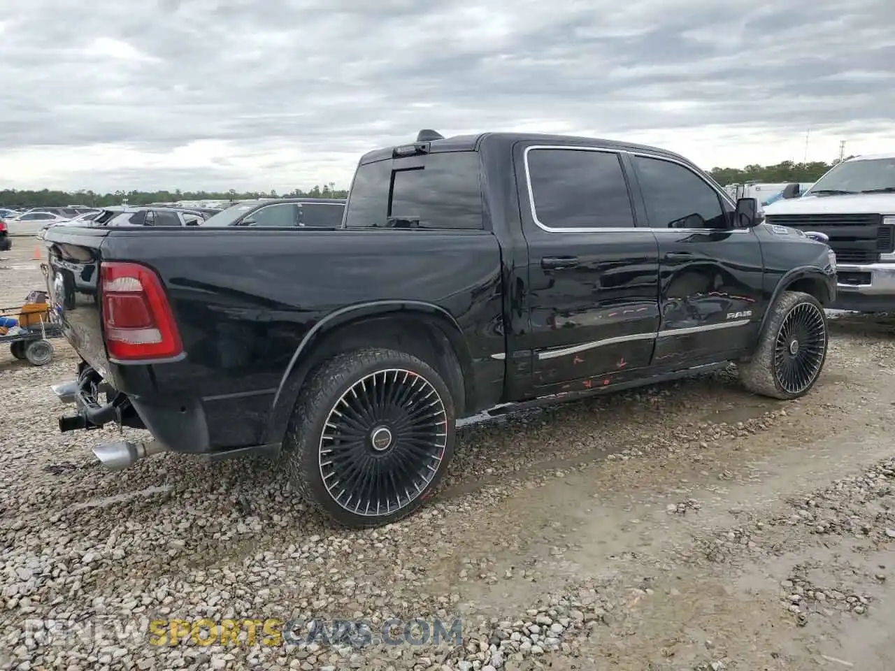 3 Photograph of a damaged car 1C6RREHTXPN604684 RAM 1500 2023