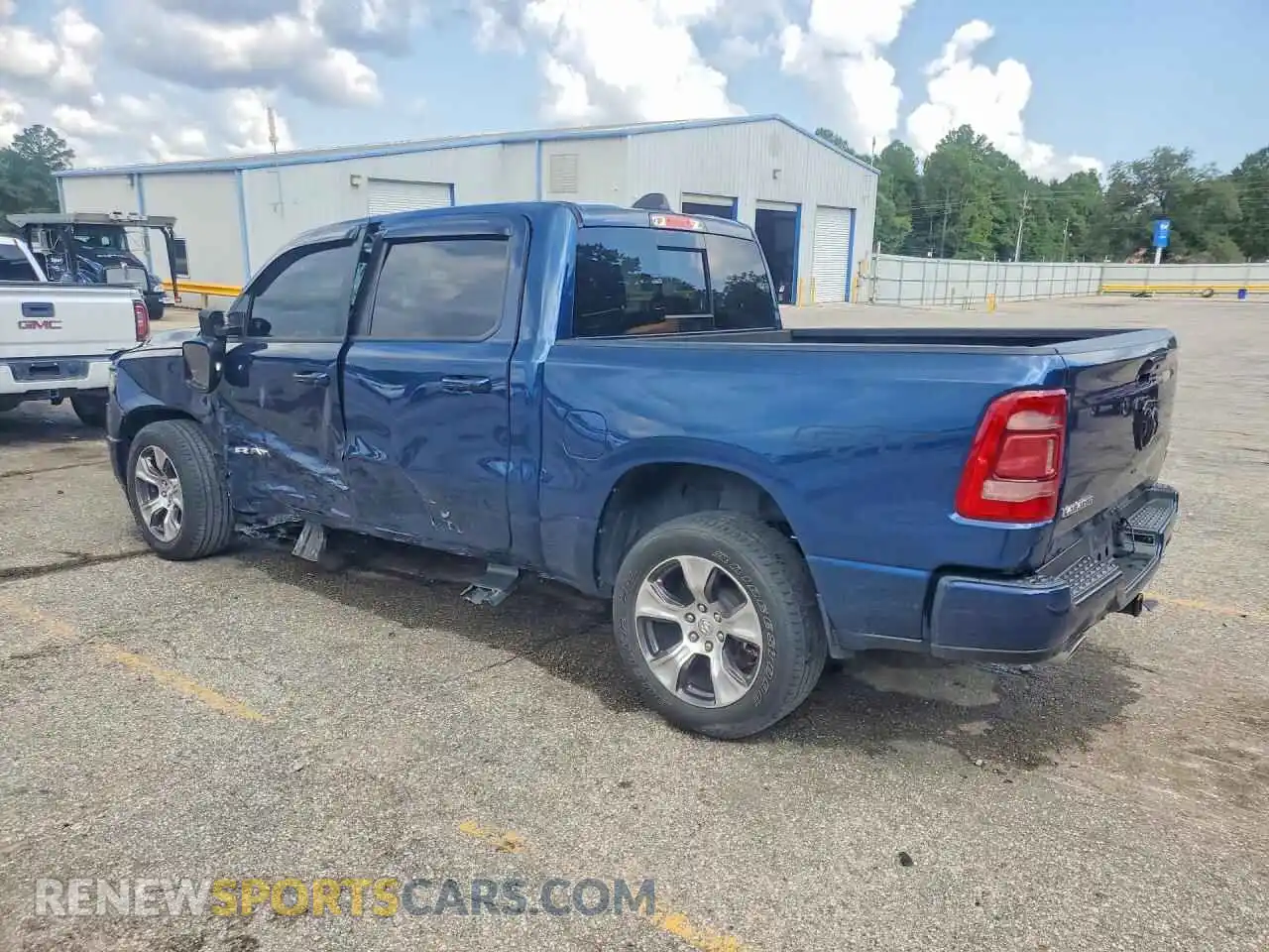 2 Photograph of a damaged car 1C6RREJT0PN670445 RAM 1500 2023