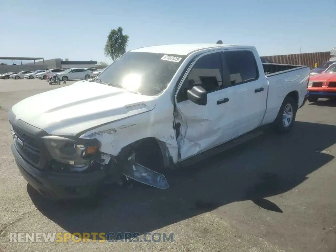 1 Photograph of a damaged car 1C6RRENT0PN693234 RAM 1500 2023