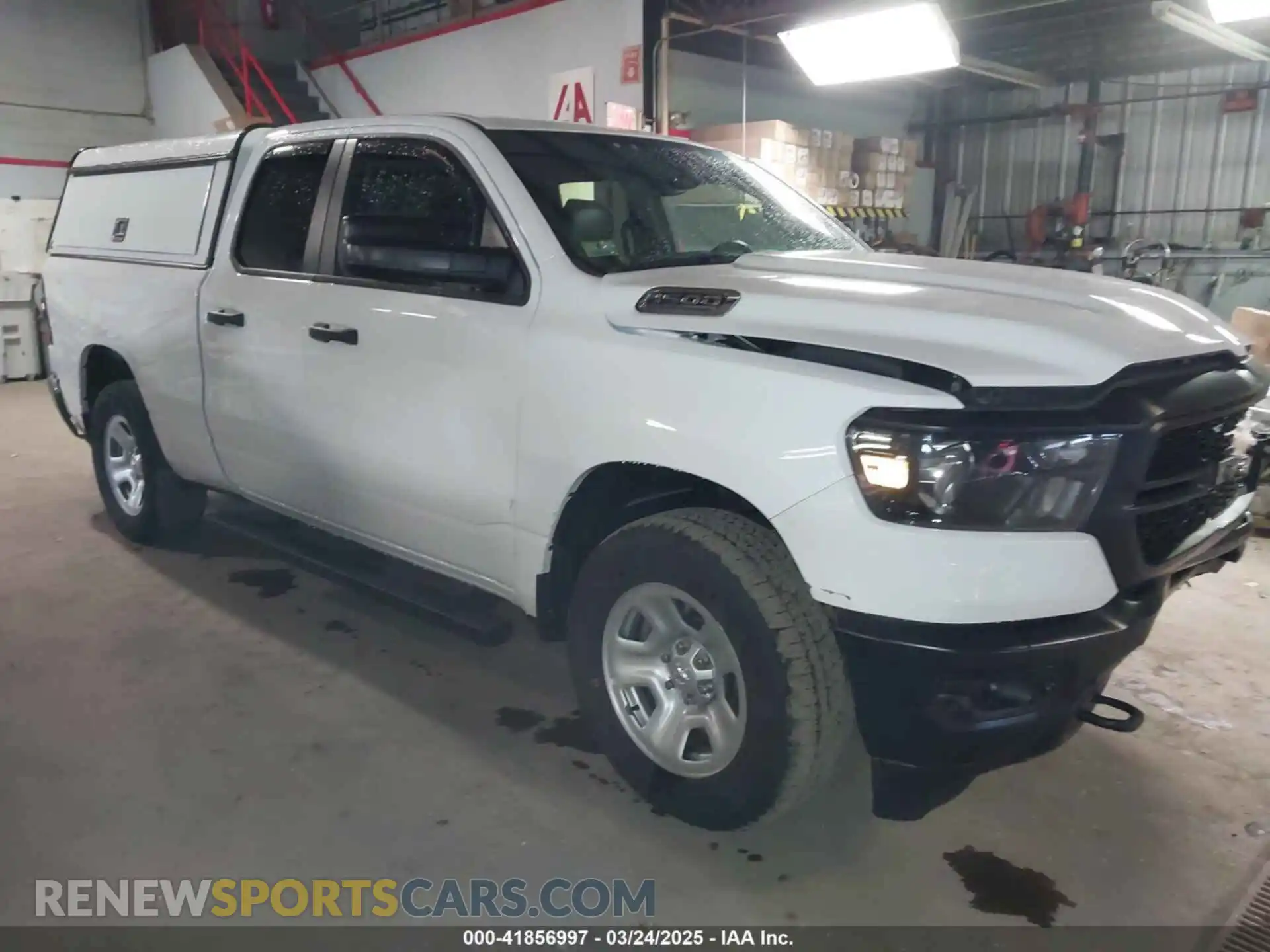 1 Photograph of a damaged car 1C6SRFCT5PN580213 RAM 1500 2023