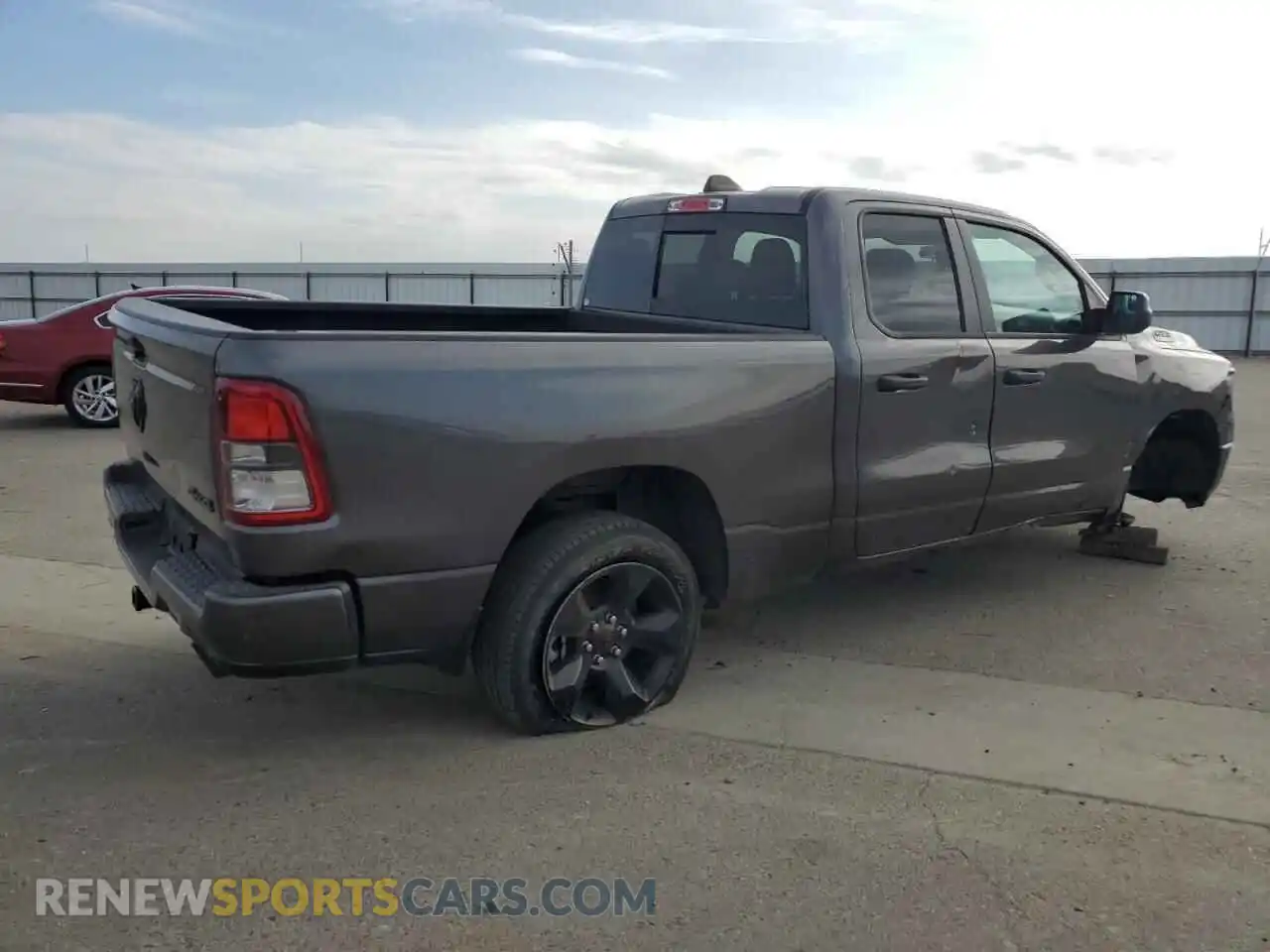 3 Photograph of a damaged car 1C6SRFCTXPN673129 RAM 1500 2023