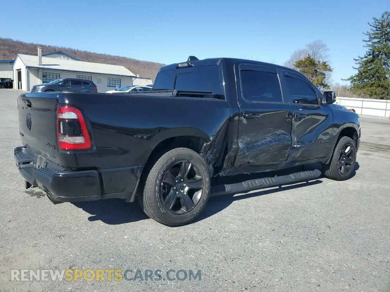 3 Photograph of a damaged car 1C6SRFFT0PN613131 RAM 1500 2023