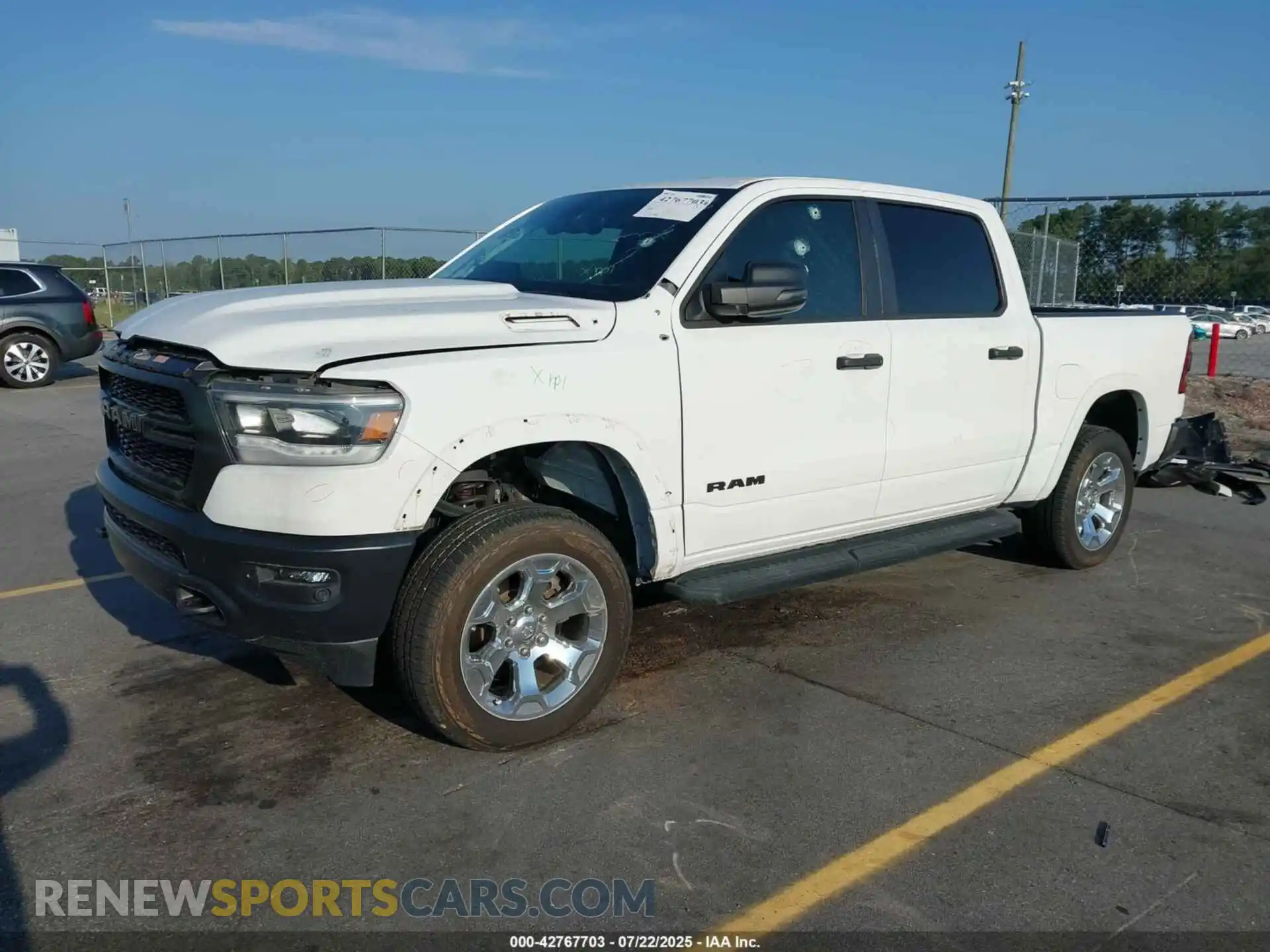 2 Photograph of a damaged car 1C6SRFFT2PN575076 RAM 1500 2023