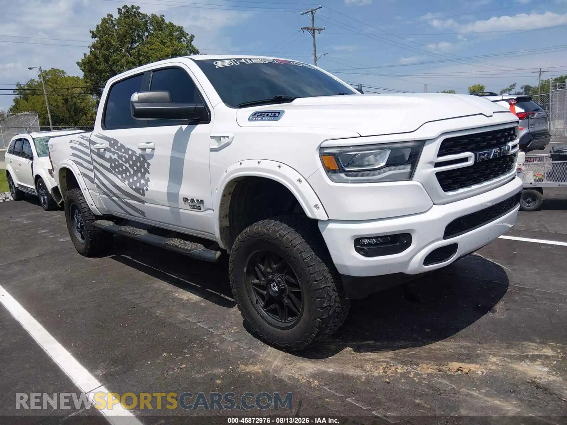 1 Photograph of a damaged car 1C6SRFFT2PN602390 RAM 1500 2023