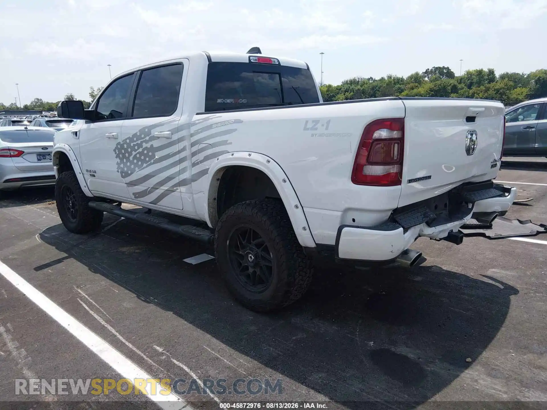 3 Photograph of a damaged car 1C6SRFFT2PN602390 RAM 1500 2023