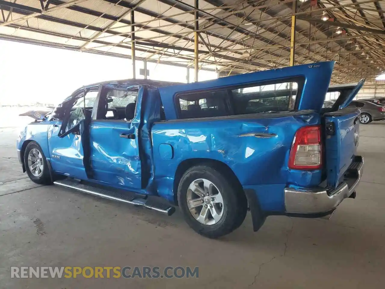 2 Photograph of a damaged car 1C6SRFFT2PN702733 RAM 1500 2023