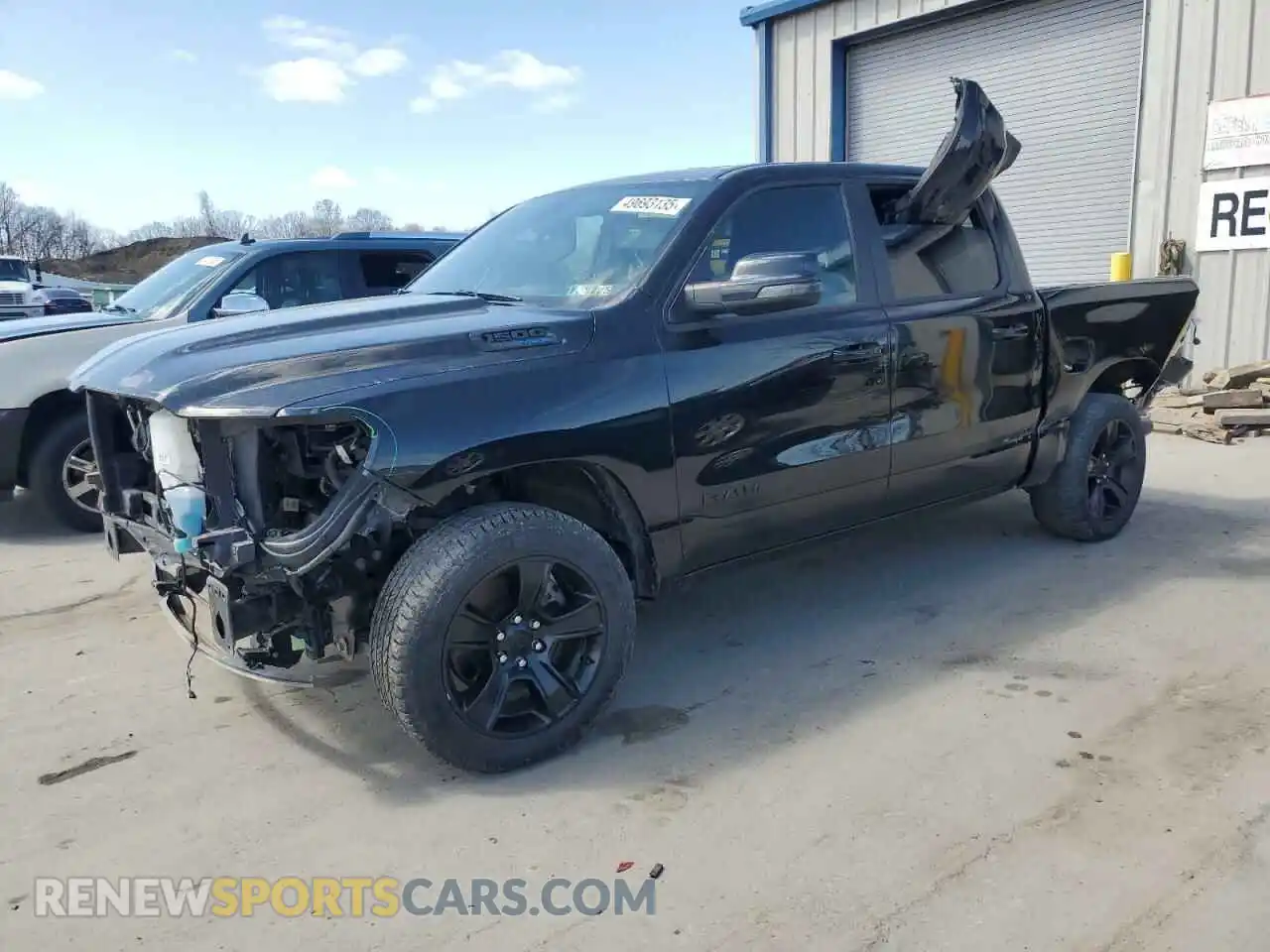 1 Photograph of a damaged car 1C6SRFFT4PN678323 RAM 1500 2023