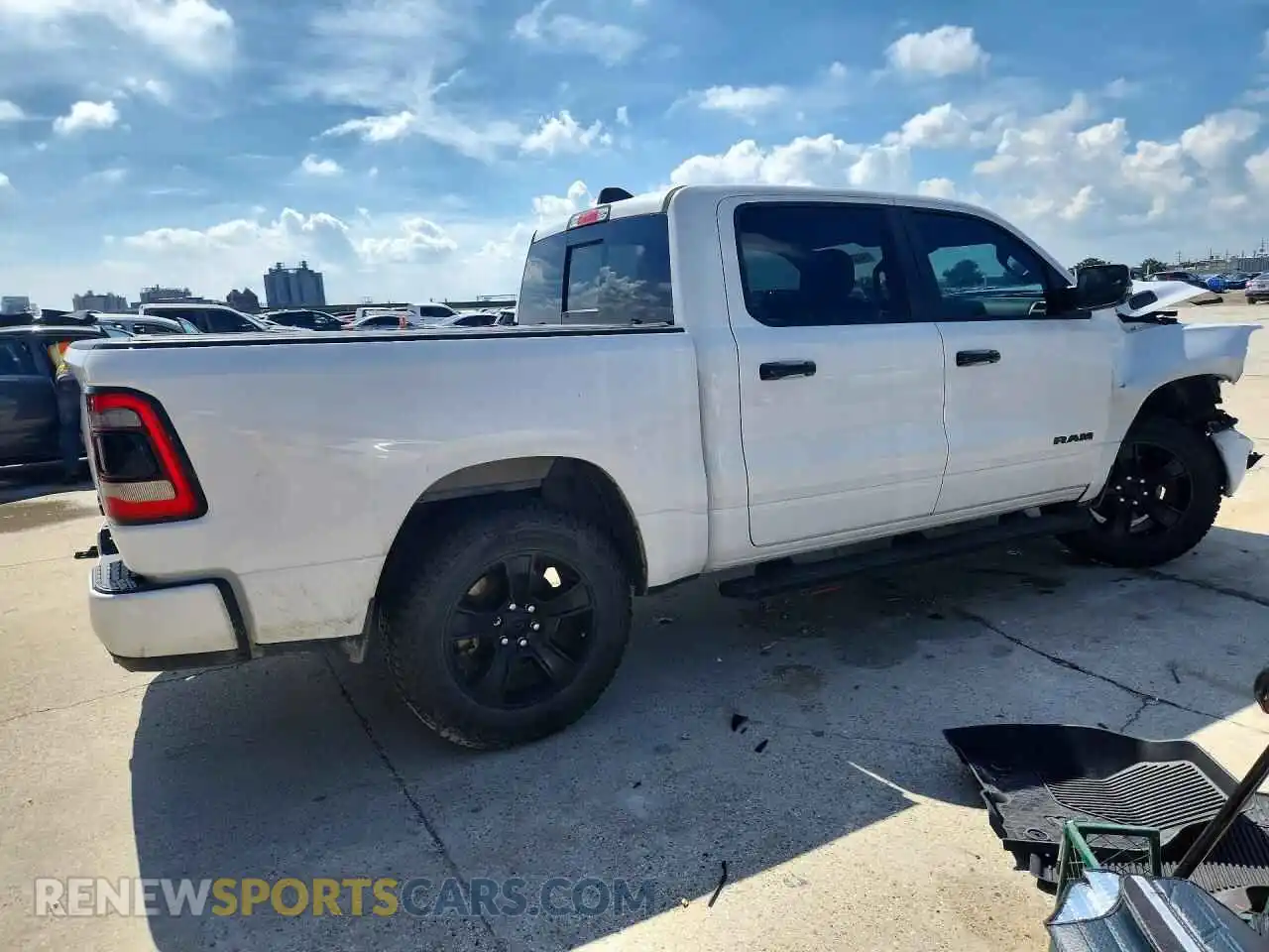 3 Photograph of a damaged car 1C6SRFFT5PN657383 RAM 1500 2023