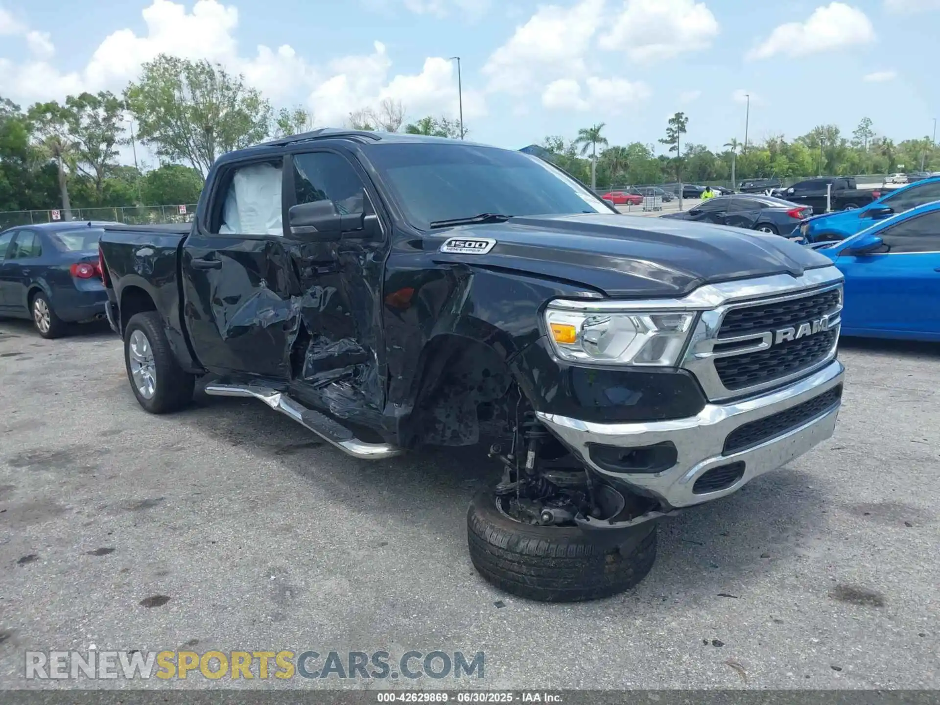 1 Photograph of a damaged car 1C6SRFFT7PN696492 RAM 1500 2023