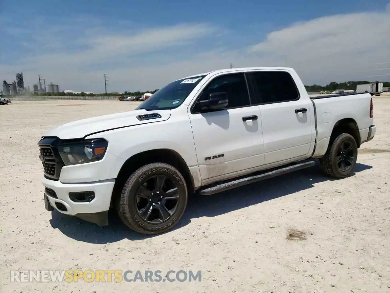 1 Photograph of a damaged car 1C6SRFFT7PN698730 RAM 1500 2023