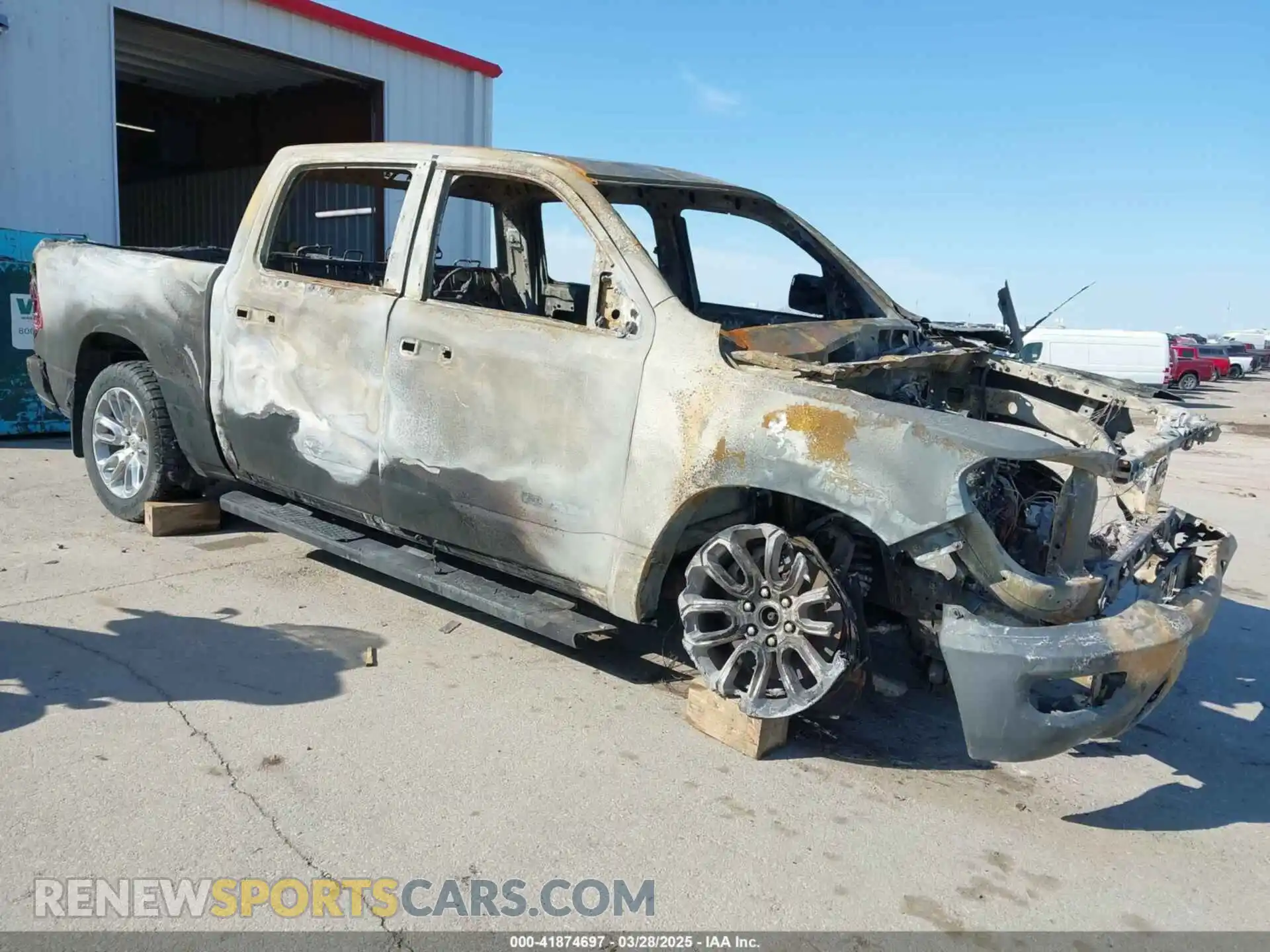 1 Photograph of a damaged car 1C6SRFJM9PN556637 RAM 1500 2023