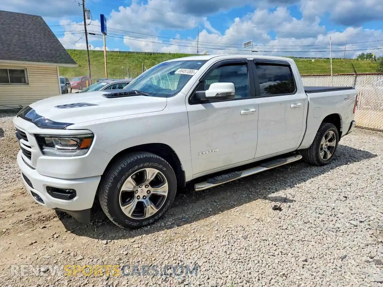1 Photograph of a damaged car 1C6SRFJT2PN520053 RAM 1500 2023