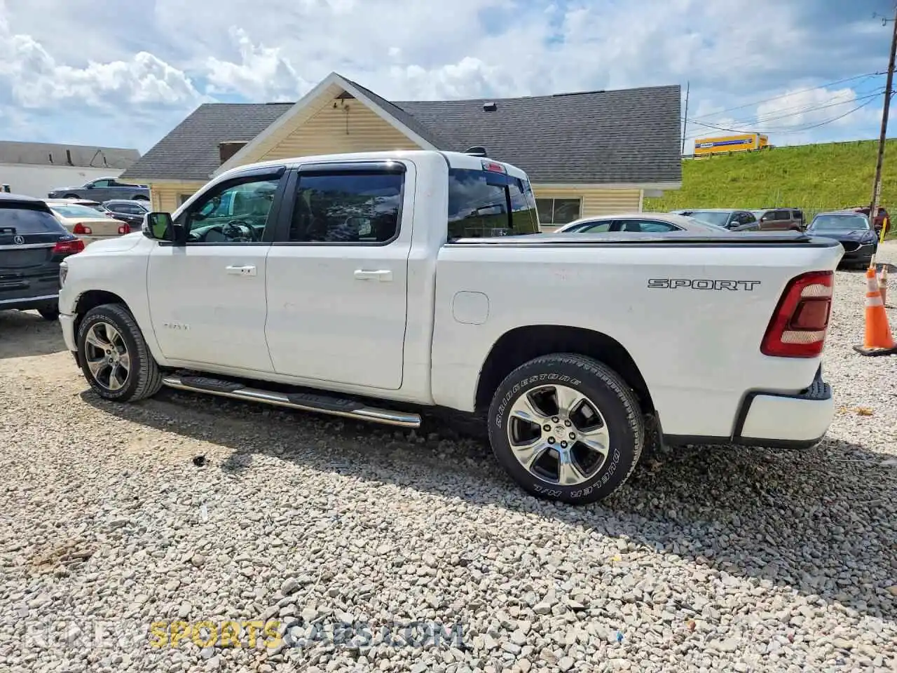 2 Photograph of a damaged car 1C6SRFJT2PN520053 RAM 1500 2023