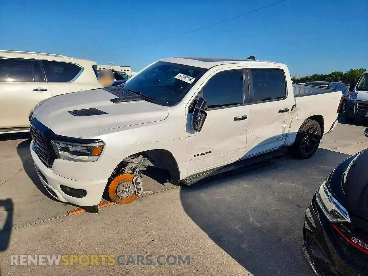 1 Photograph of a damaged car 1C6SRFJT3PN577460 RAM 1500 2023