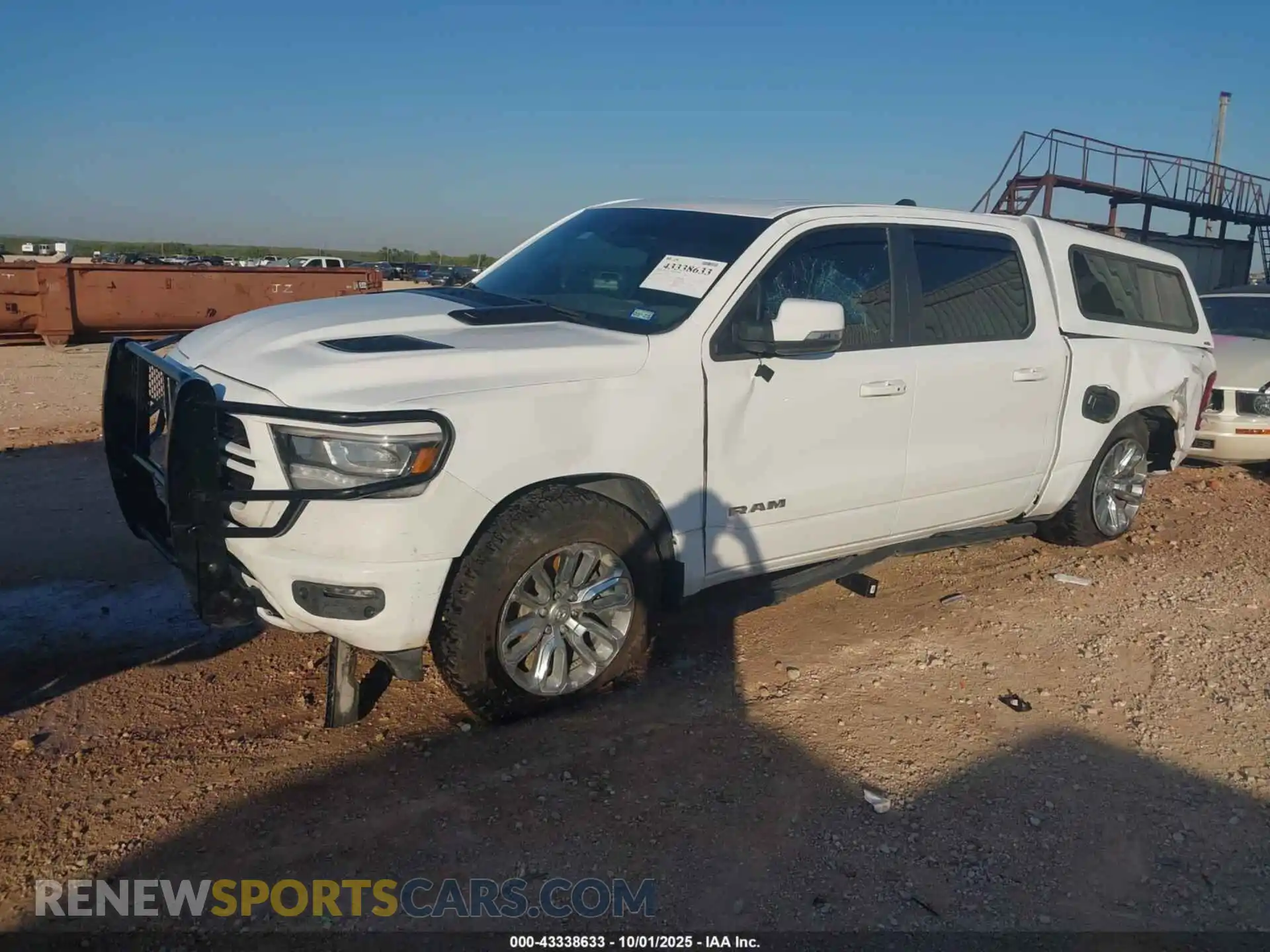 2 Photograph of a damaged car 1C6SRFJT3PN675307 RAM 1500 2023