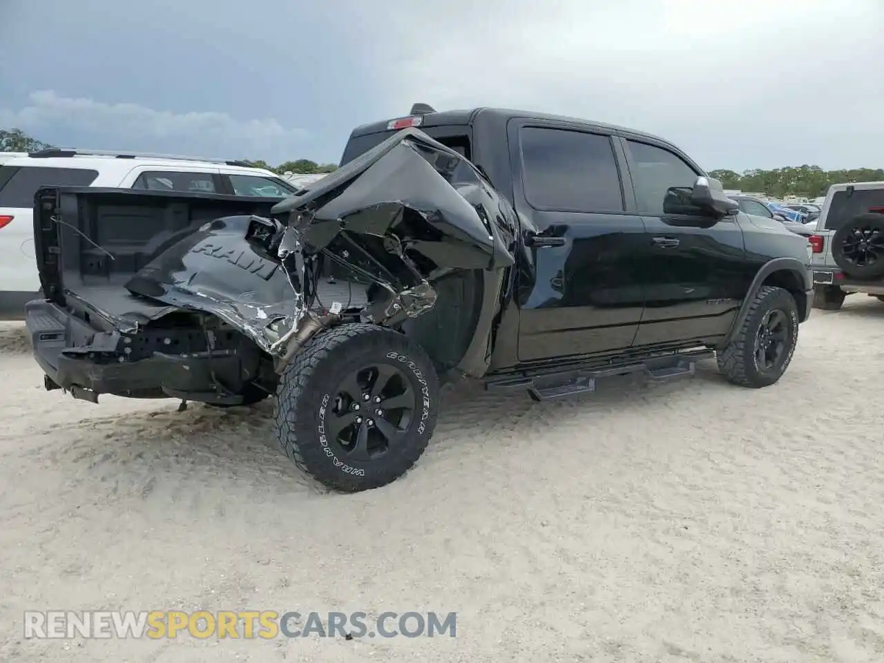 3 Photograph of a damaged car 1C6SRFLT8PN609879 RAM 1500 2023