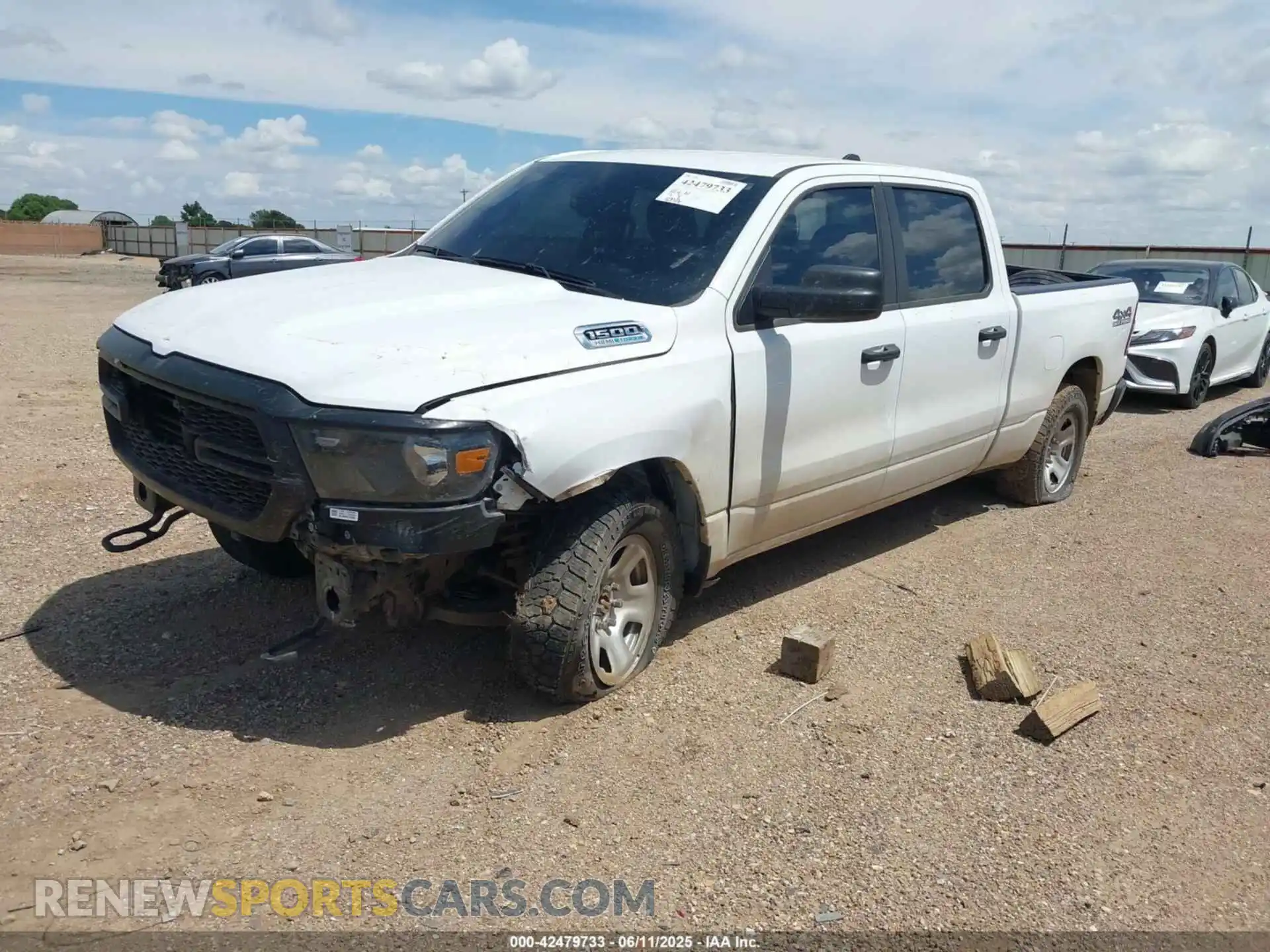2 Photograph of a damaged car 1C6SRFNT7PN593705 RAM 1500 2023