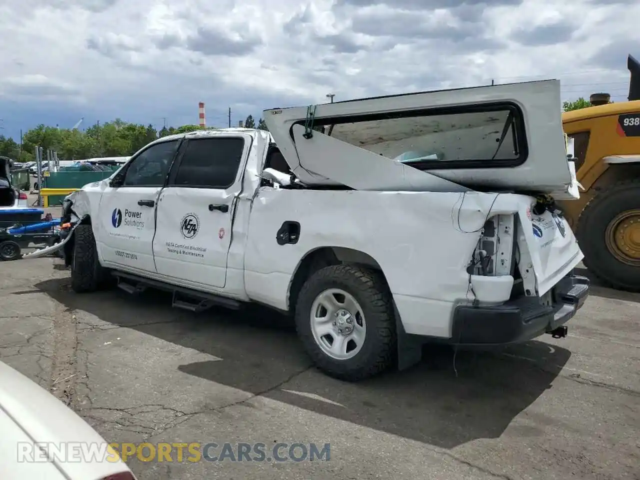 2 Photograph of a damaged car 1C6SRFNTXPN566160 RAM 1500 2023