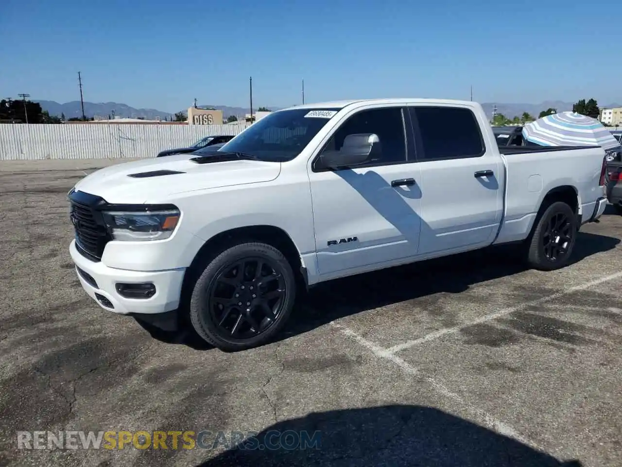 1 Photograph of a damaged car 1C6SRFRT5PN662840 RAM 1500 2023