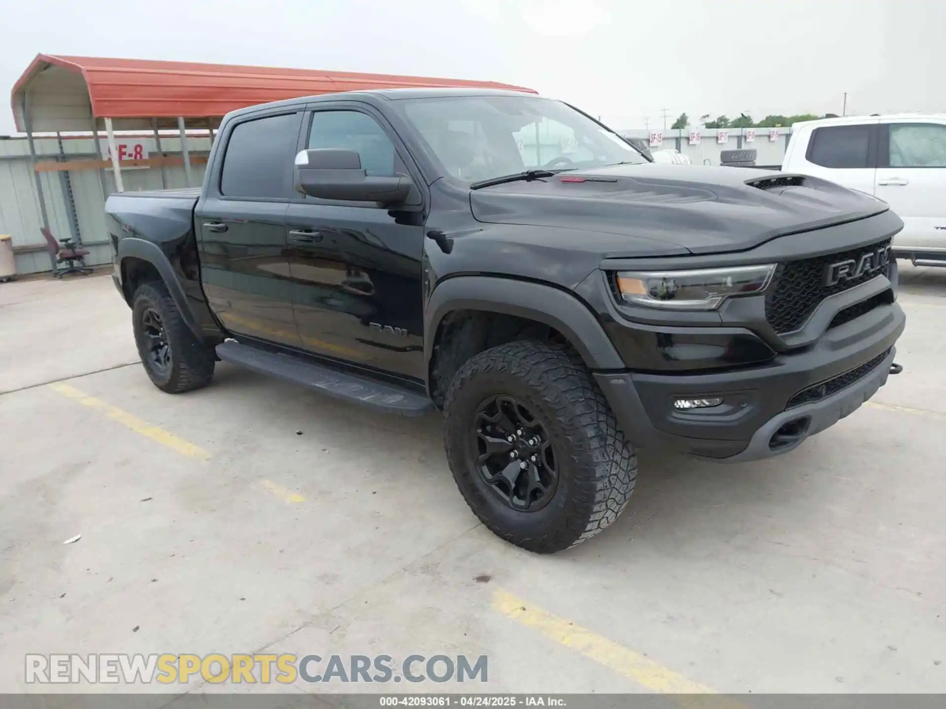 1 Photograph of a damaged car 1C6SRFU93PN572940 RAM 1500 2023