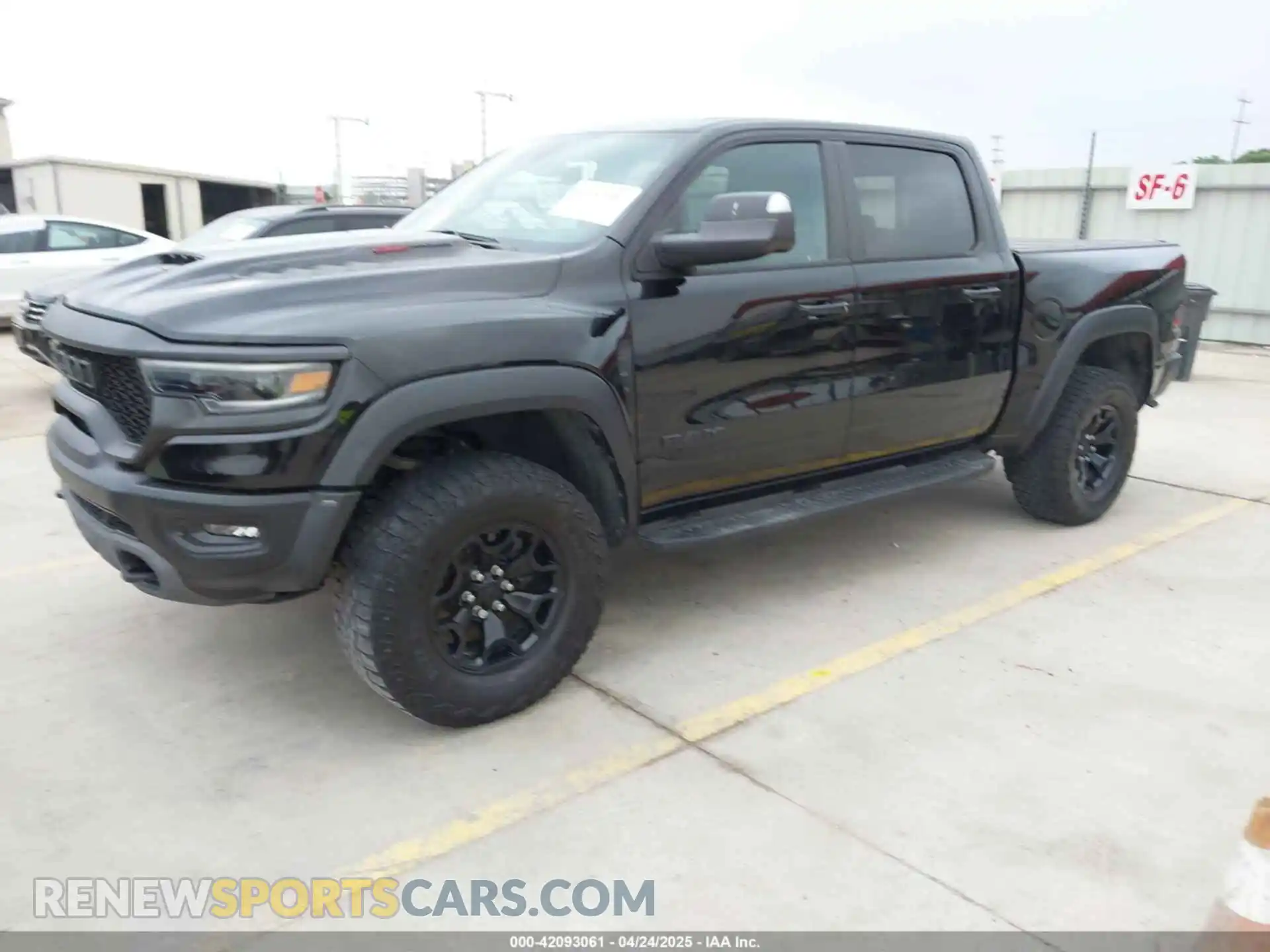 2 Photograph of a damaged car 1C6SRFU93PN572940 RAM 1500 2023