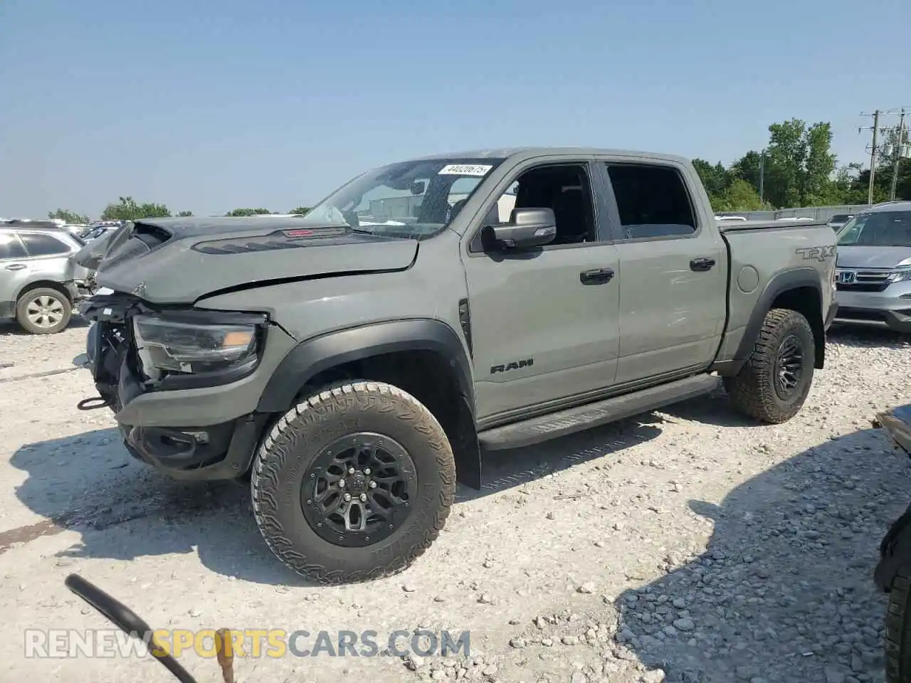 1 Photograph of a damaged car 1C6SRFU97PN695494 RAM 1500 2023