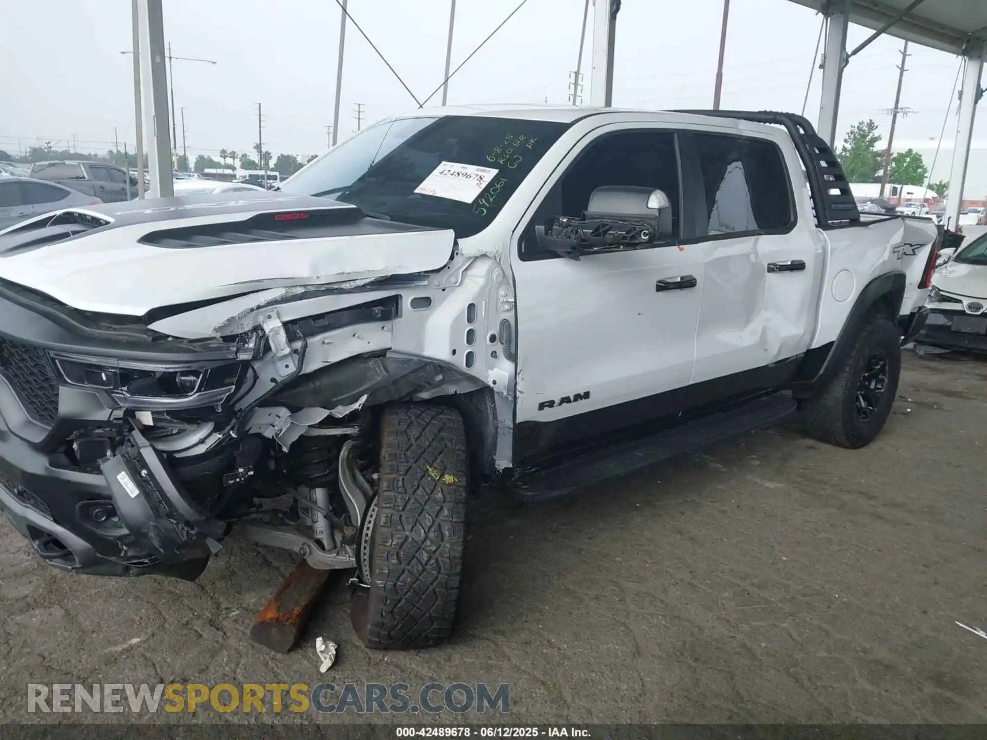 2 Photograph of a damaged car 1C6SRFU99PN592061 RAM 1500 2023