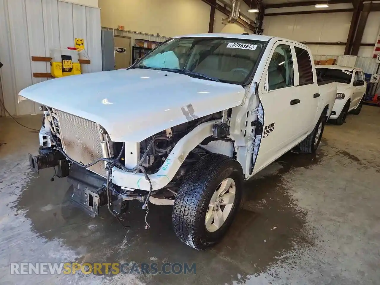 1 Photograph of a damaged car 3C6RR6KT2PG674638 RAM 1500 2023