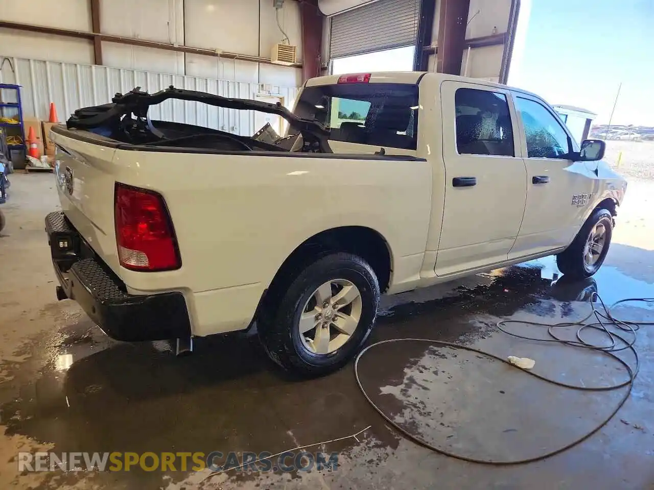 3 Photograph of a damaged car 3C6RR6KT2PG674638 RAM 1500 2023