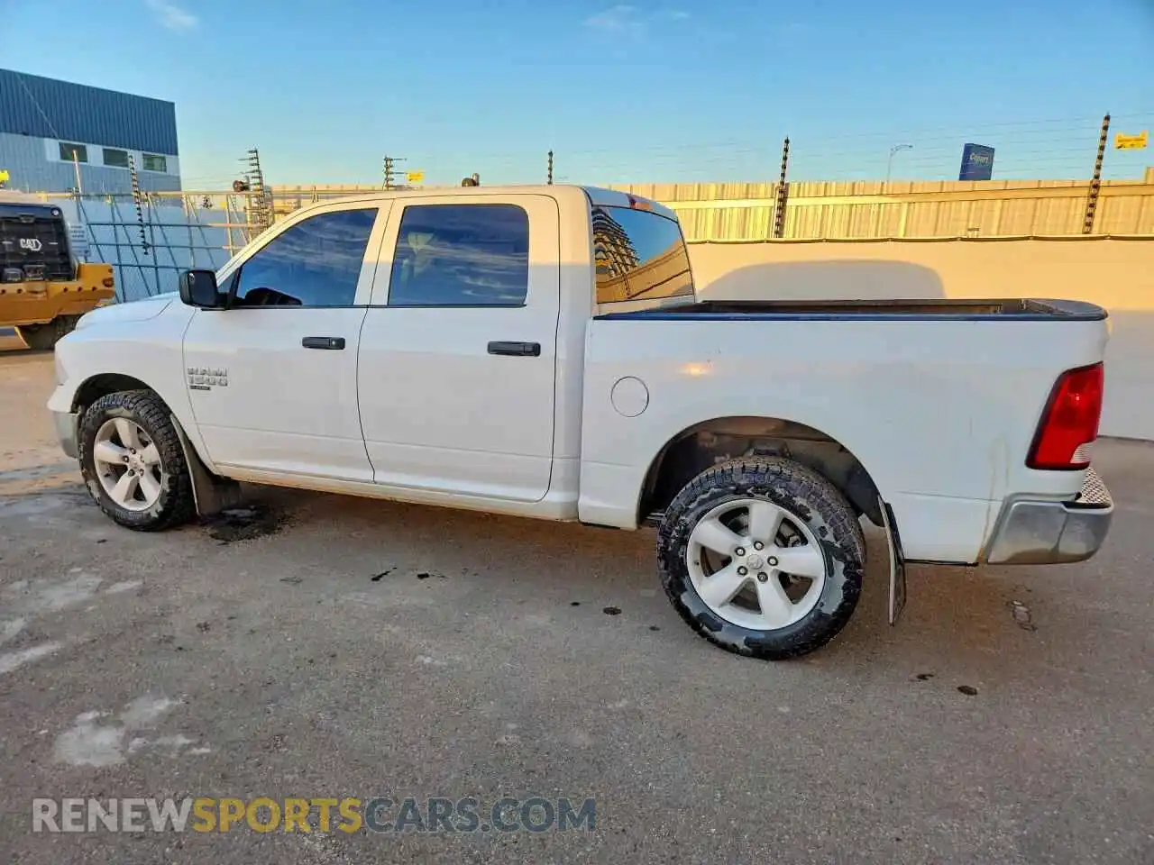 2 Photograph of a damaged car 3C6RR7KG8PG657769 RAM 1500 2023