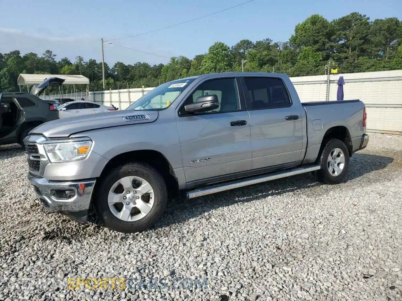 1 Photograph of a damaged car 1C6RREFT8RN146018 RAM 1500 2024