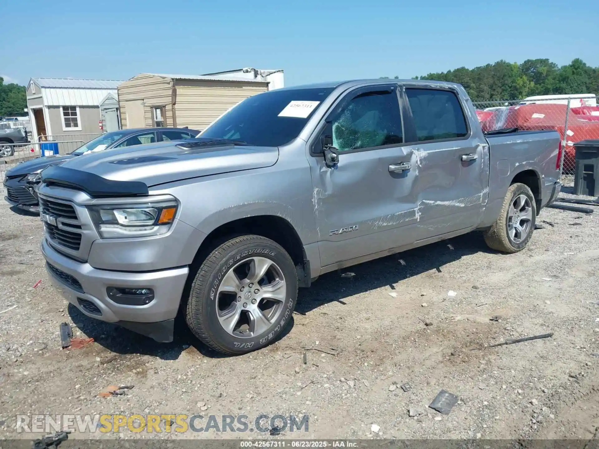 2 Photograph of a damaged car 1C6SRFJT2RN107679 RAM 1500 2024