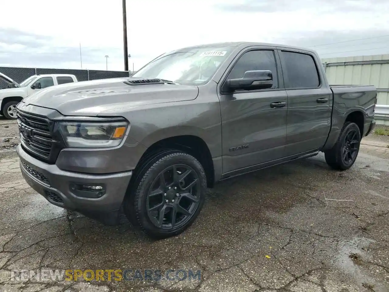 1 Photograph of a damaged car 1C6SRFJTXRN133236 RAM 1500 2024