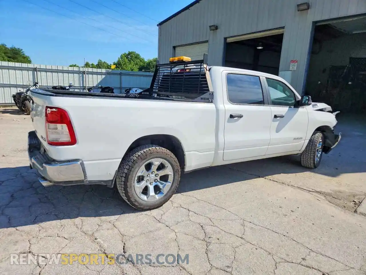 3 Photograph of a damaged car 1C6SRFMT0RN131104 RAM 1500 2024
