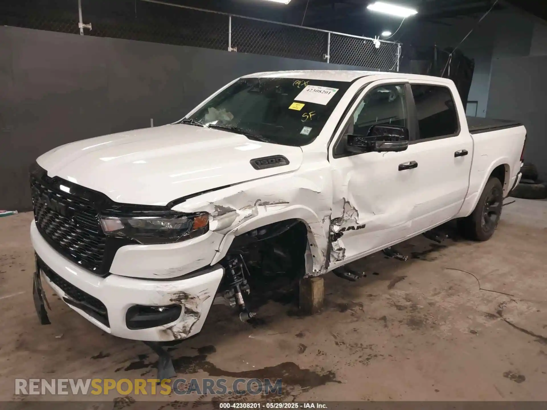 2 Photograph of a damaged car 1C6SRFFP9SN703082 RAM 1500 2025