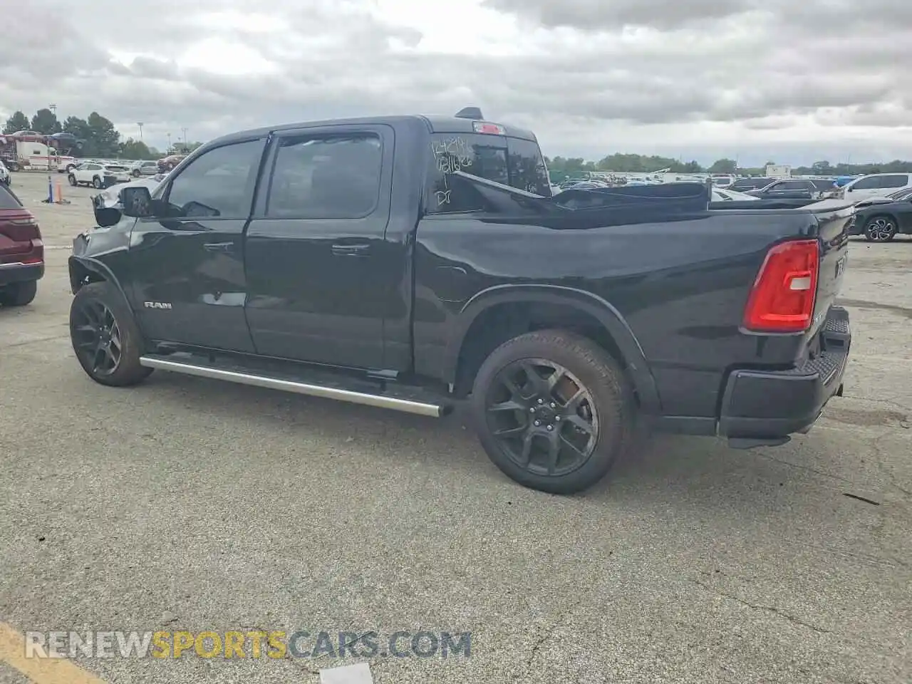 2 Photograph of a damaged car 1C6SRFJP5TN394803 RAM 1500 2026
