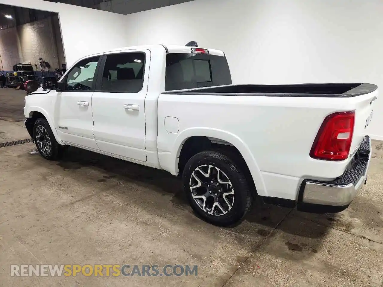 2 Photograph of a damaged car 3C6SRFJP1T4202335 RAM 1500 2026