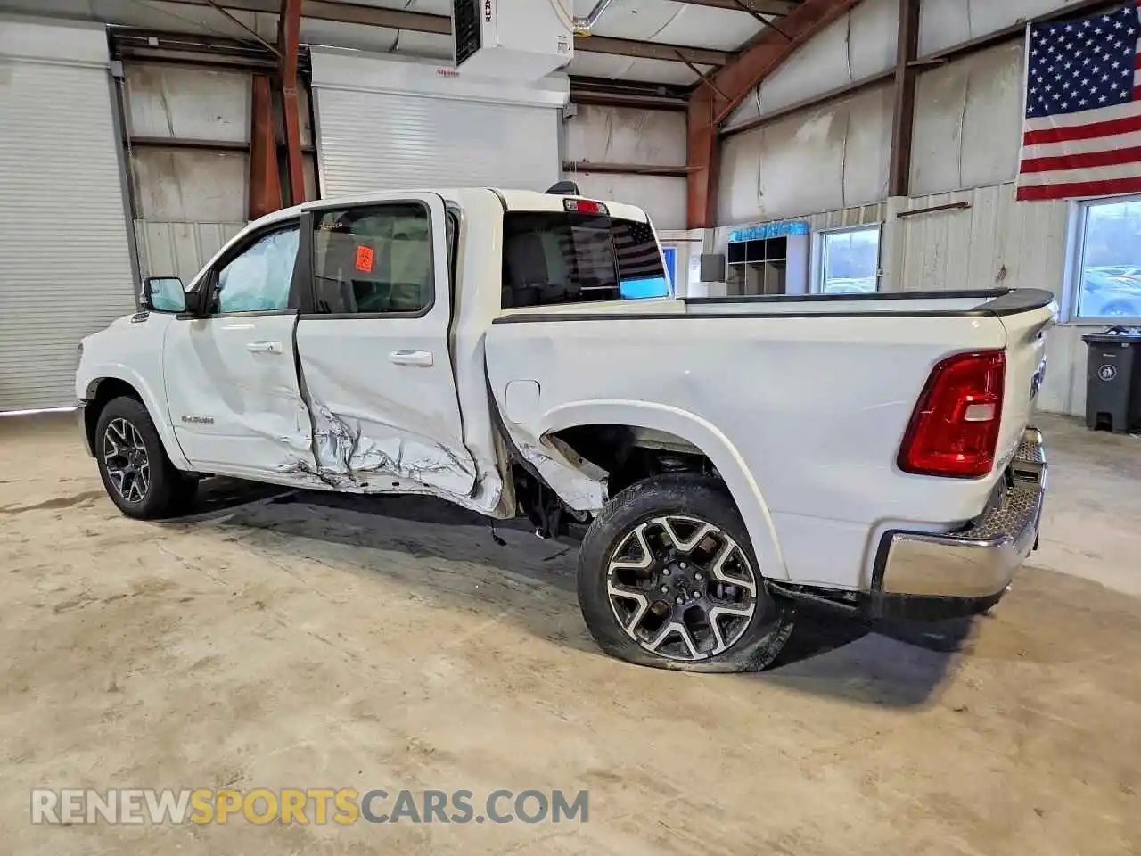2 Photograph of a damaged car 3C6SRFJP5T4177083 RAM 1500 2026