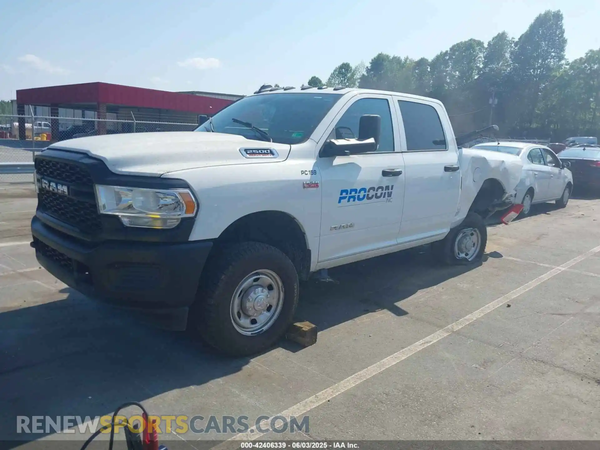2 Photograph of a damaged car 3C6UR5CJ6KG556859 RAM 2500 2019